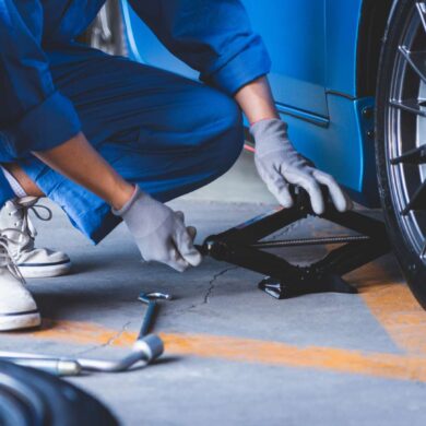 Certified mechanic changing a wheel out at Car Dr in Orlando, Florida